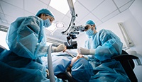 dentists placing dental implants