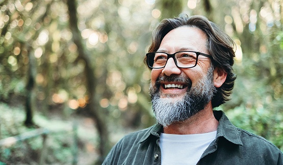 Man smiling outside