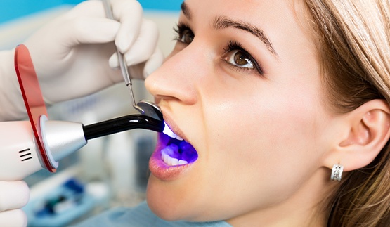 Woman receiving dental bonding treatment