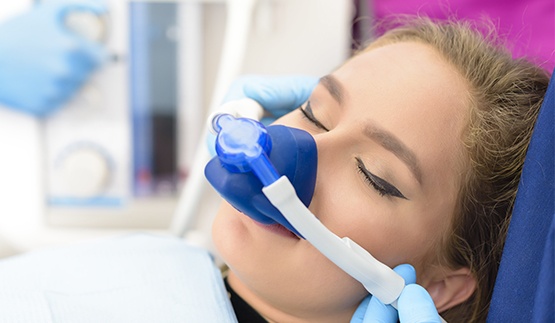 Woman with nitrous oxide mask over her nose