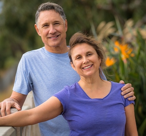 Smiling older man and woman outdoors