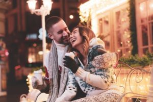 Couple smiling together in holiday setting