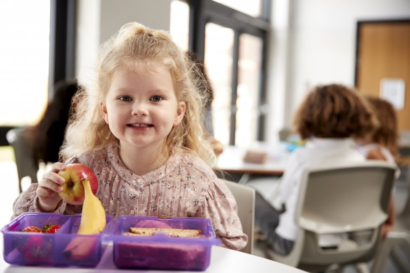 young girl eating her school lunch