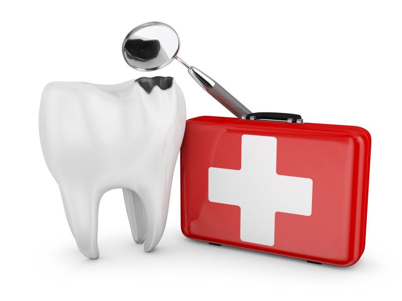 Giant damaged tooth next emergency dental kit
