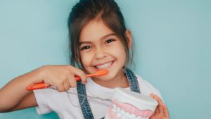 a child smiling while visiting the dentist