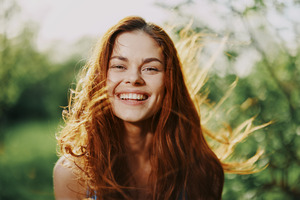 Someone smiling in a field