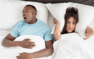 Woman annoyed by her partner’s snoring